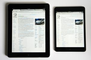 iPad 1st generation compared with iPad Mini, both showing English Wikipedia main page (vertical screen position)